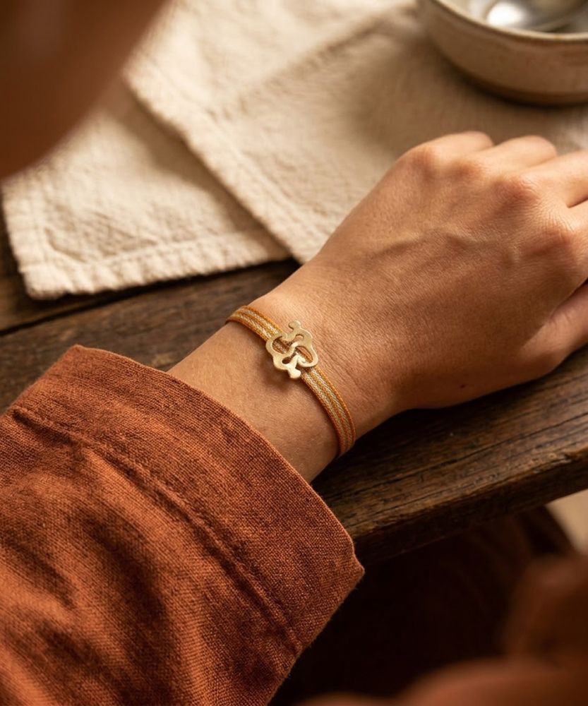 PULSERA CON CHARM - MONO NARIÑO