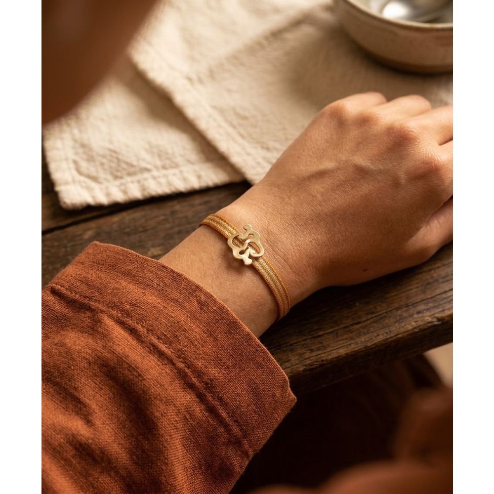 PULSERA CON CHARM - MONO NARIÑO